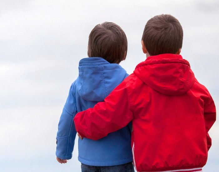 two boys pointing