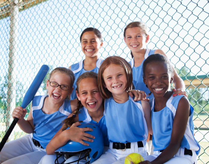 softball players giving high fives