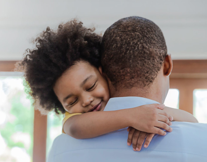 adult hugging a child